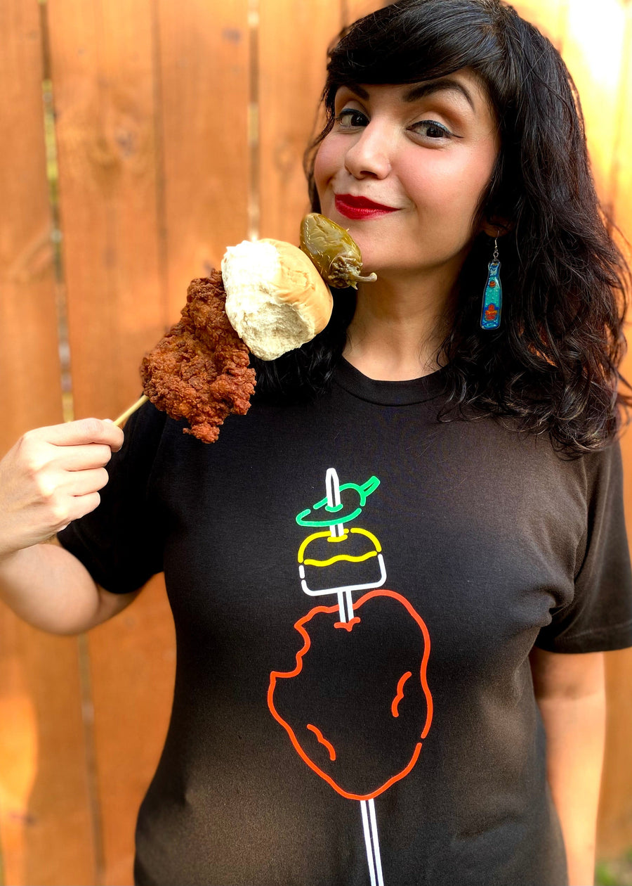 BarbacoApparel's Neon Chicken-On-A-Stick Graphic Tee (on female model)